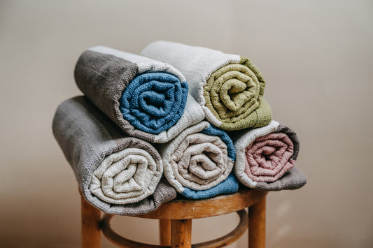 Cotton yoga mat rolled on the chair